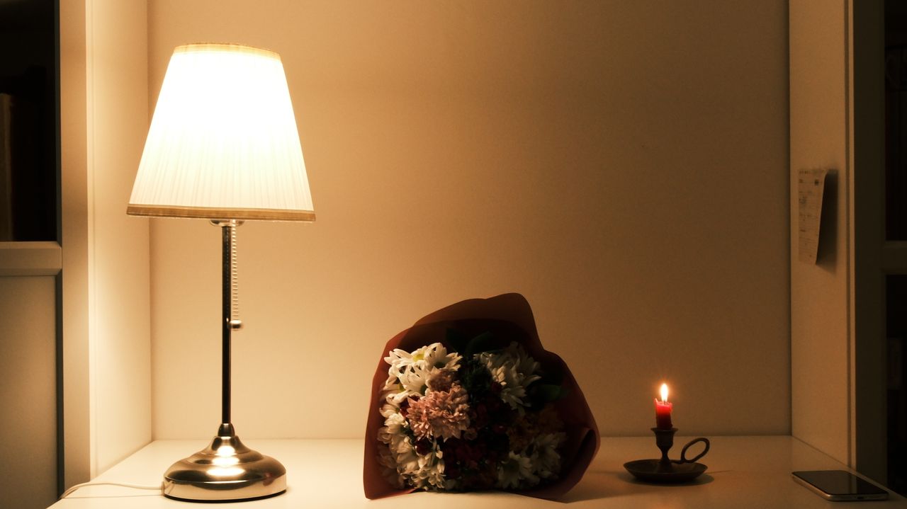 Lit Pabbly Candles on a pale shelf